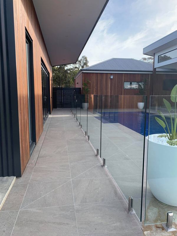 frameless glass pool fencing around swimming pool area