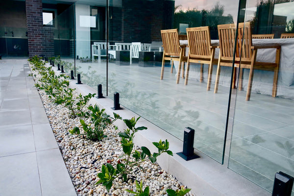 How to Style Your Outdoor Space for Summer Entertaining (and Elevate It With Glass Pool Fencing)