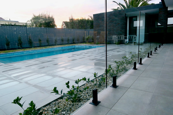 backyard swimming pool with frameless pool fencing panels