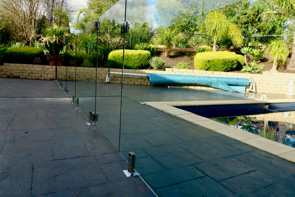 glass pool fencing installed around swimming pool