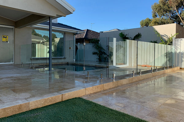 glass pool fencing installed around swimming pool area